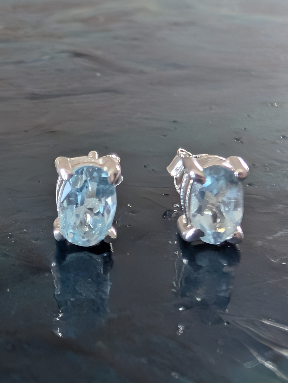Sterling Silver Genuine Blue Topaz Oval Stud Earrings ๐